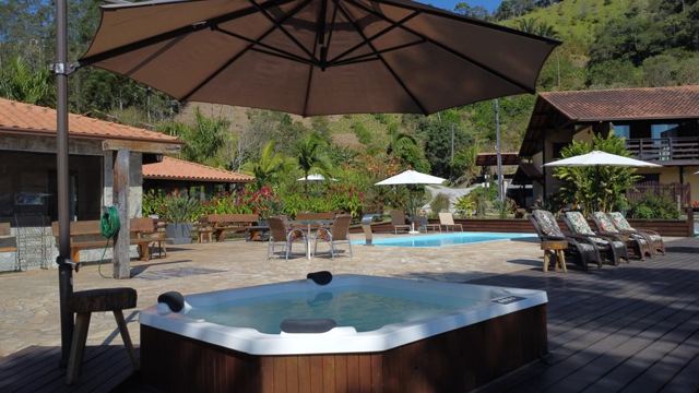 Hot tub on the deck with umbrellas