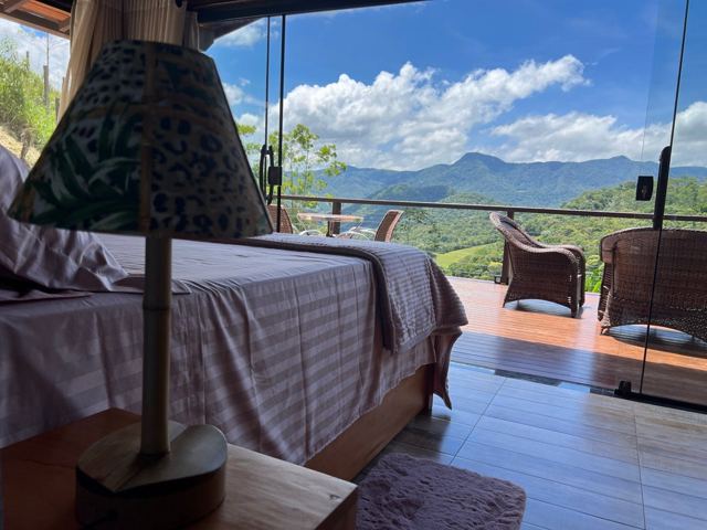 Double bed with lamp and mountain view